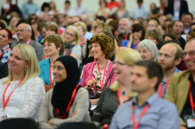 Several hundred teachers, academics and policy makers have packed into Raine's Foundation school in Bethnal Green