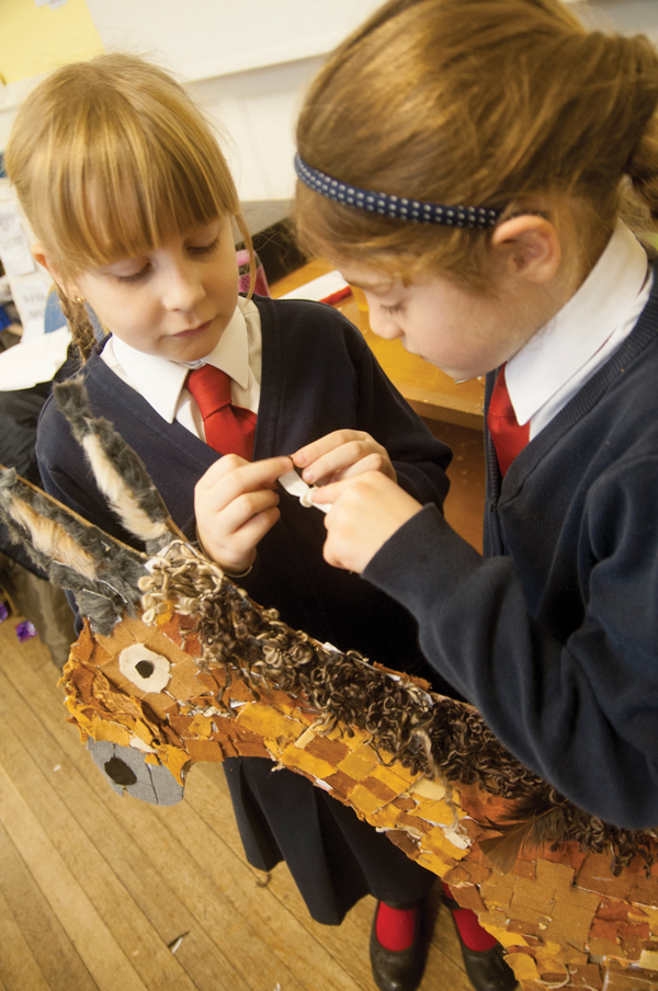 L to R: Rosie Callicott Year 3 and Maddy Lynch Year 4 working hard on their part for the giant nativity scene