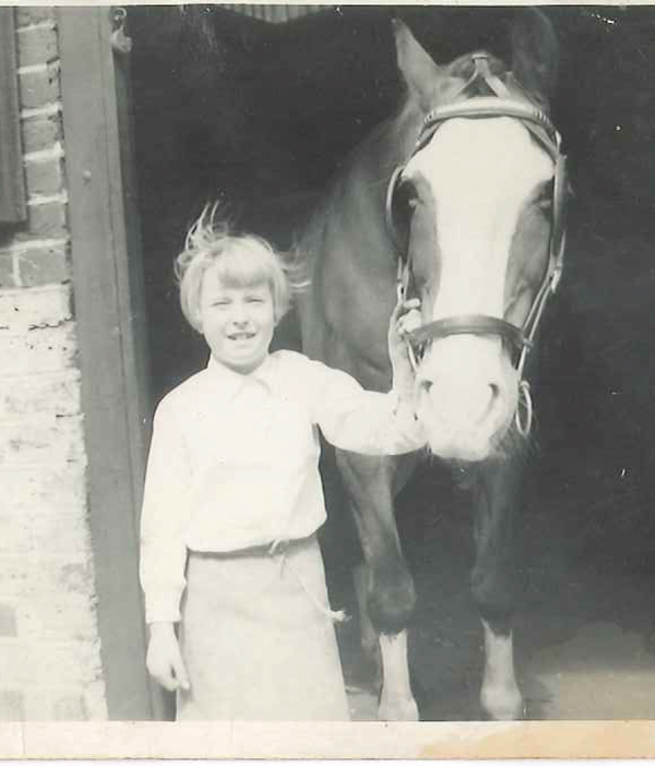 Sue aged 9 at her grandfather’s forge, wearing a leather apron her grandfather made