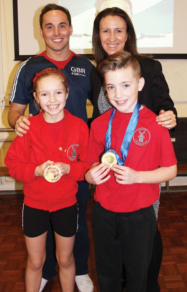 World champion gymnast and school ambassador Daniel Keatings with Windmill primary school headteacher, Miss Michelle Ginn and pupils Mason and Lacey, both aged 10