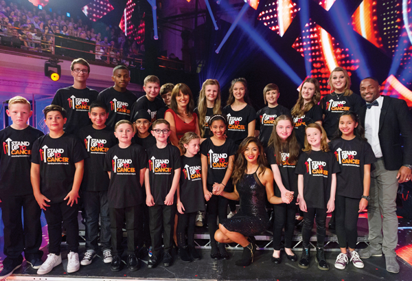 Adam Brombley (back left), 15, takes part in Stand Up 2 Cancer with Nicole Scherzinger and Davina McCall