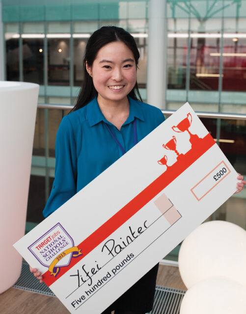 Yifei holding her winning £500 cheque after victory at the TARGETjobs competition