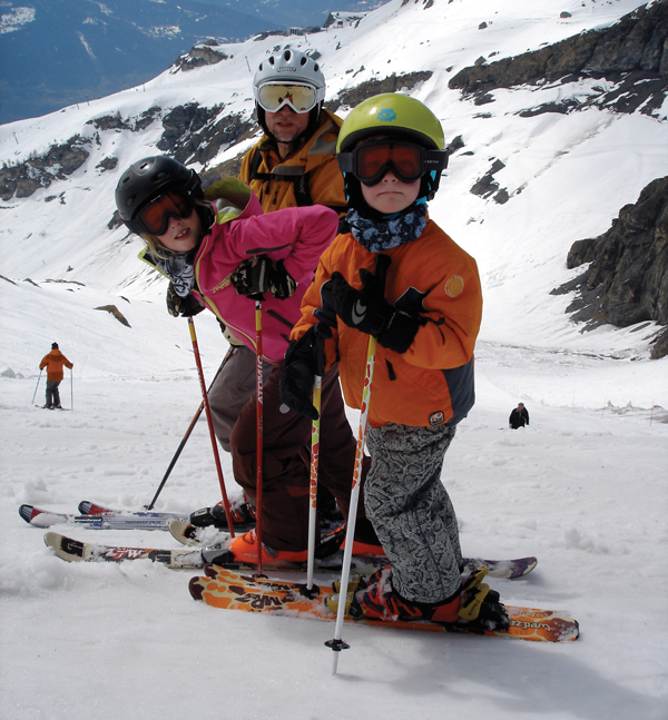 Tim skiing with children Erin (11) and Alex (9)