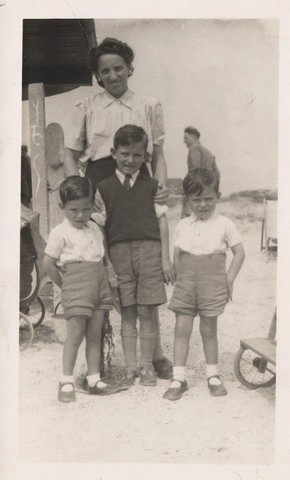 Twins Roy and Alan with older brother Brian in the middle and mother Dora behind