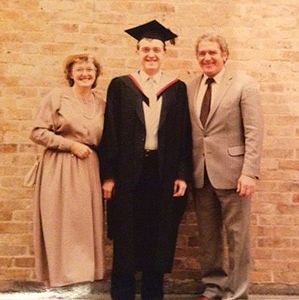 . . . and with his parents on graduation day