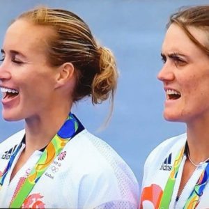 Glover and Stanning singing the national anthem on the medal podium