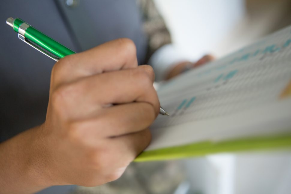 Writing down on checklist | Schools Week