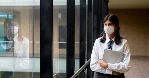 The government has changed its policy on face coverings for pupils going to school.